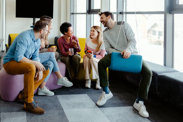 Business colleague taking break in modern office break out area